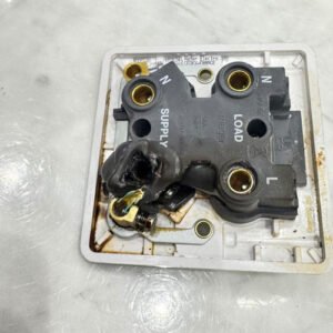Melted 40A water heater isolator discovered in a commercial kitchen in Hackney.