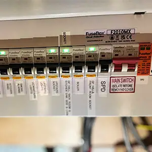 HMO consumer unit upgrade in E12 with RCBO protection, AFDD devices, and surge protection device installed.