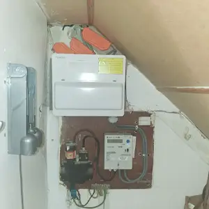 Old fuse board in RM8 showing green goo leaking from degraded PVC cable insulation during EICR inspection.