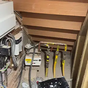 Under‑Stair Utilities — Identifying fire risks where gas and electrical services are exposed without fire‑rated compartmentation